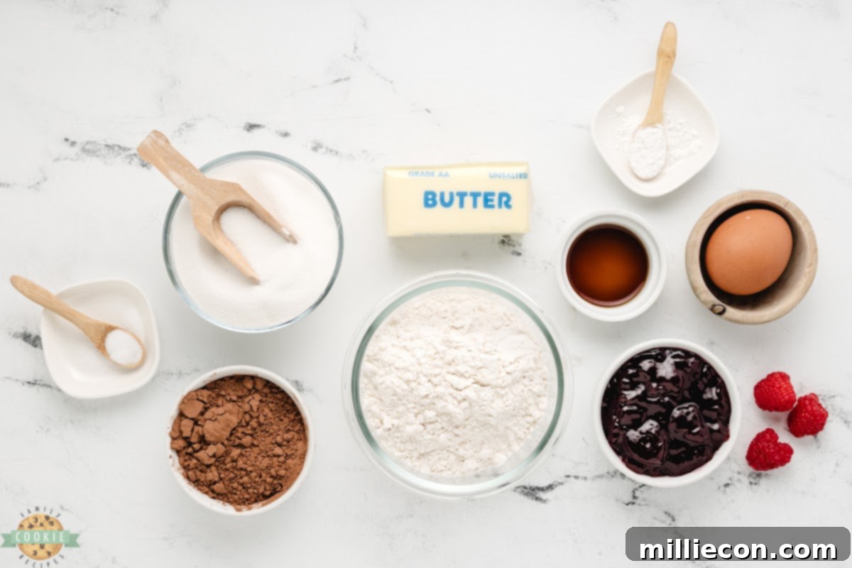 Raspberry Chocolate Kiss Cookies 3 Ingredients needed to make Raspberry Chocolate Thumbprint Cookies, laid out for easy preparation.