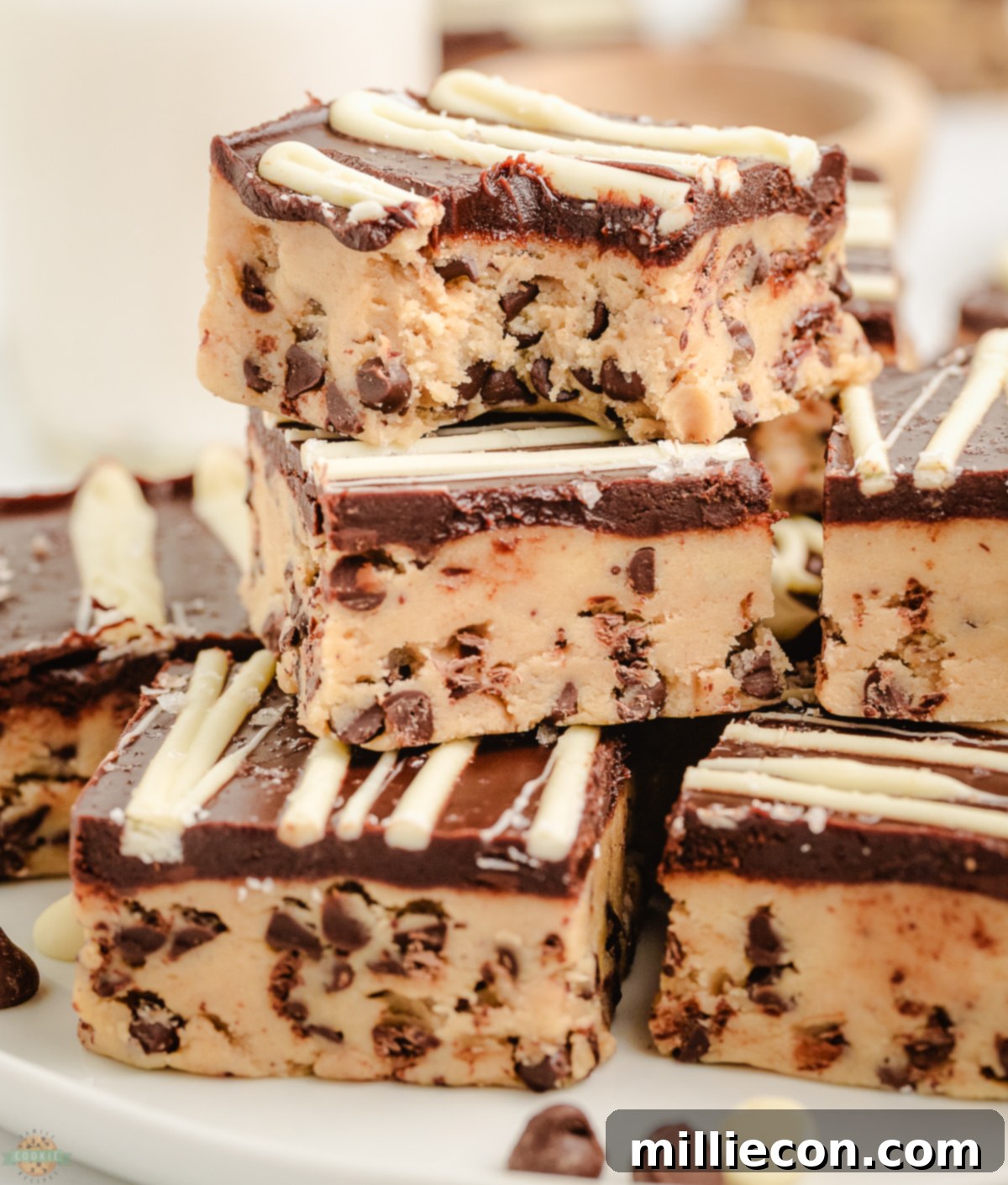 Cookie dough bars with a bite taken out, showcasing their soft and chewy texture.