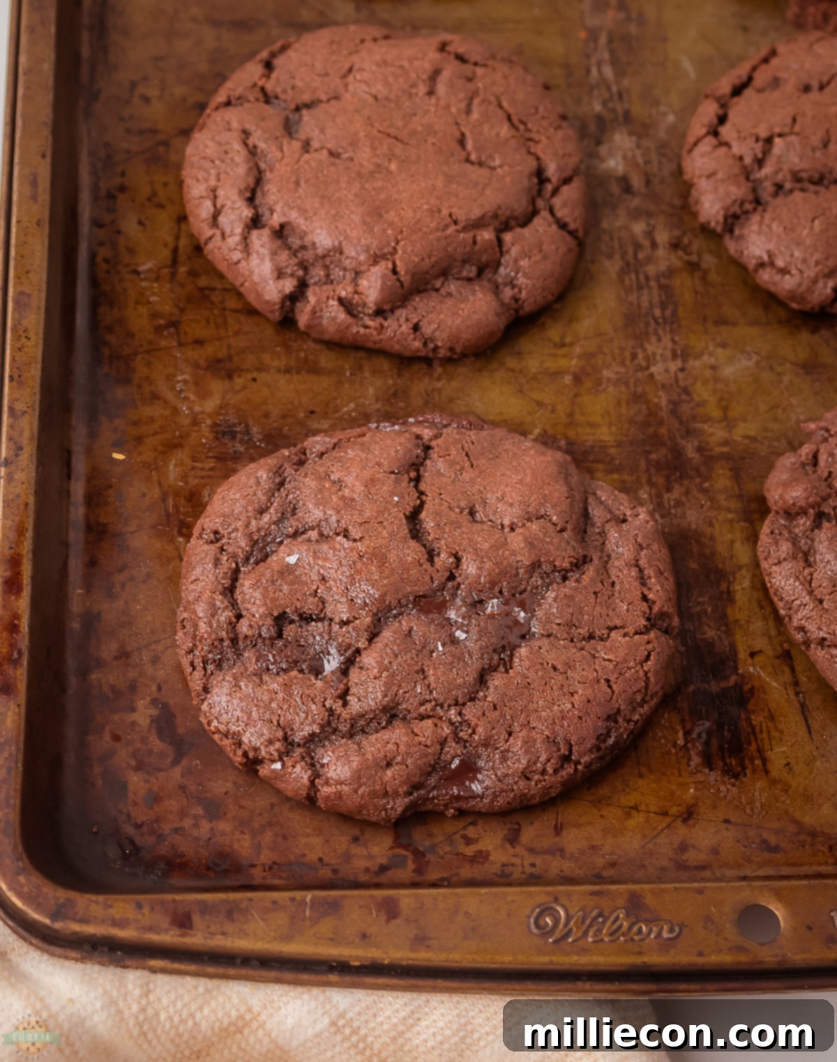 Molten Chocolate Lava Cookies 4 Chocolate lava cookies on a baking sheet ready to bake